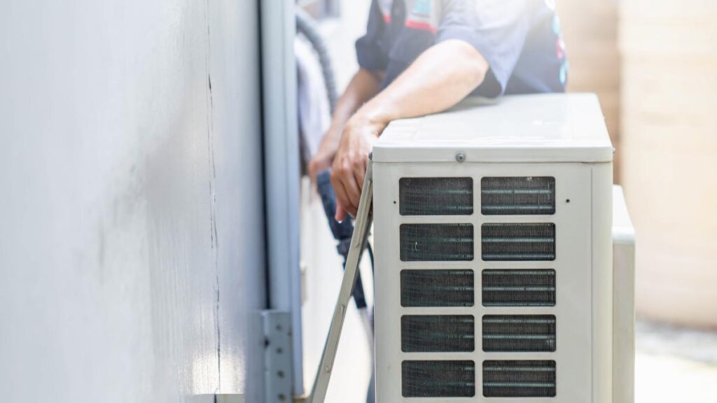 guy doing some furnace maintenance