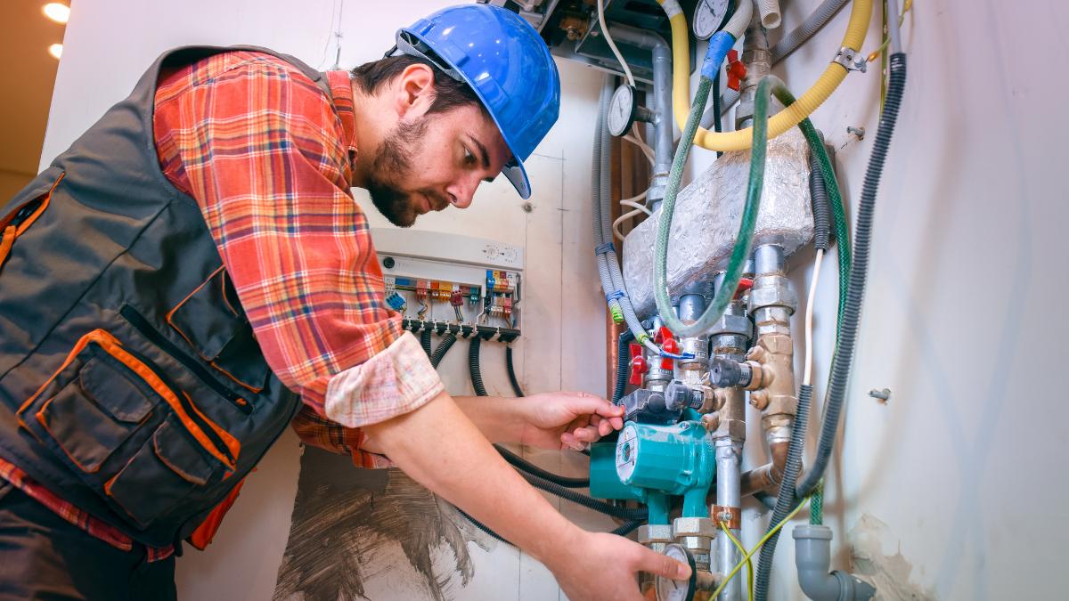 worker doing heating system check