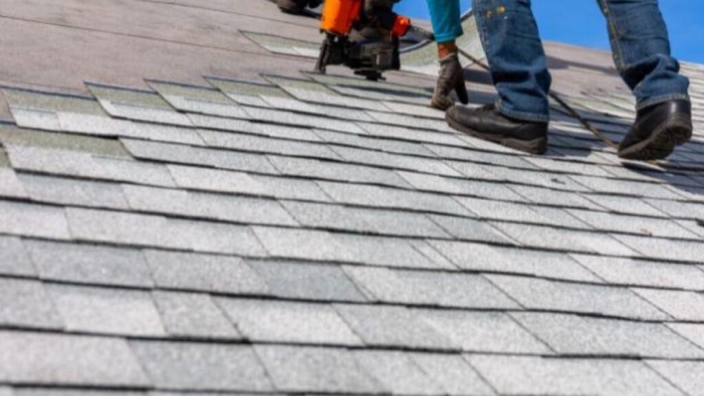 worker fixing roof