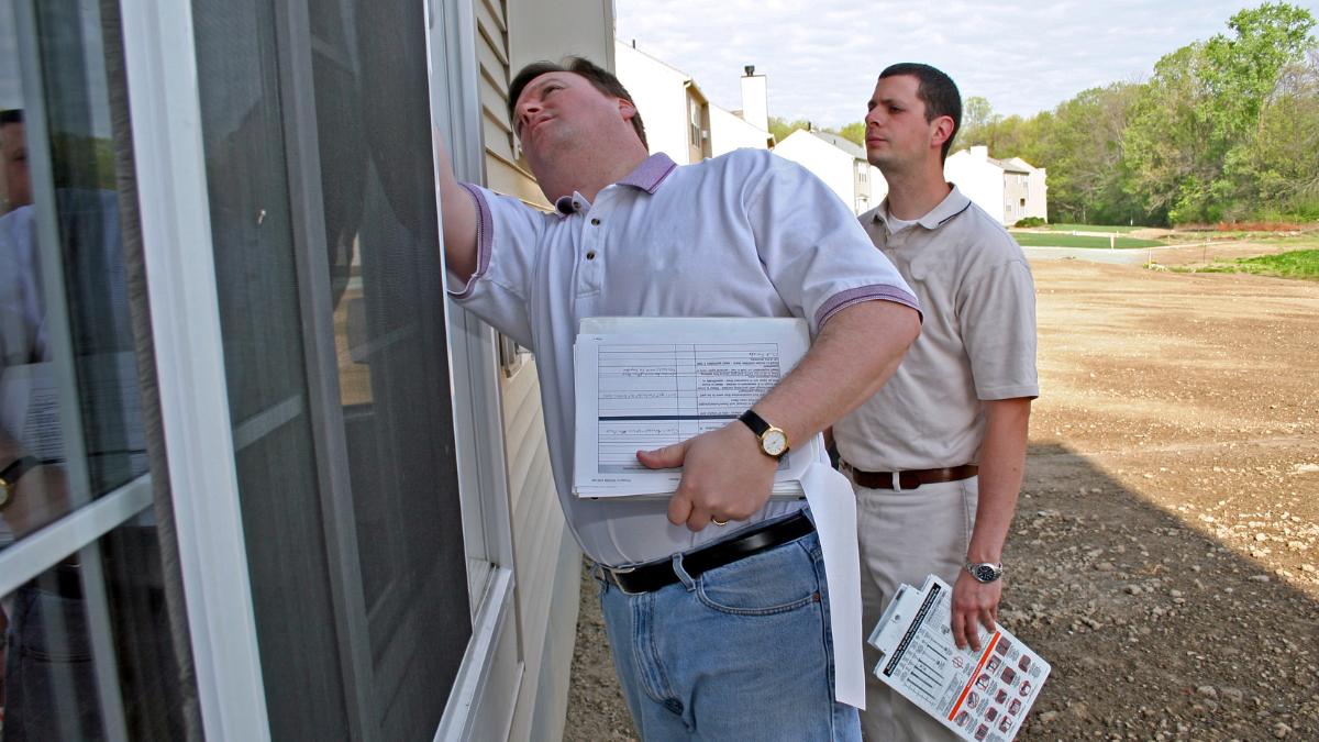 home inspector checking a window