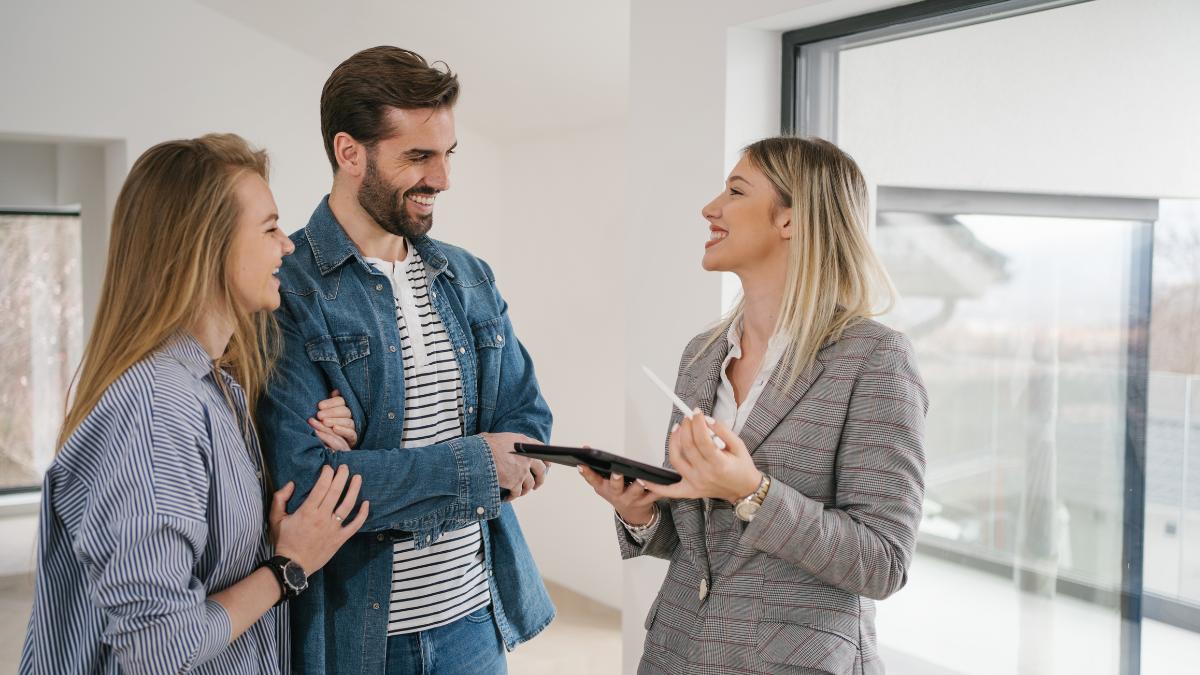 couple talking to a real estate agent