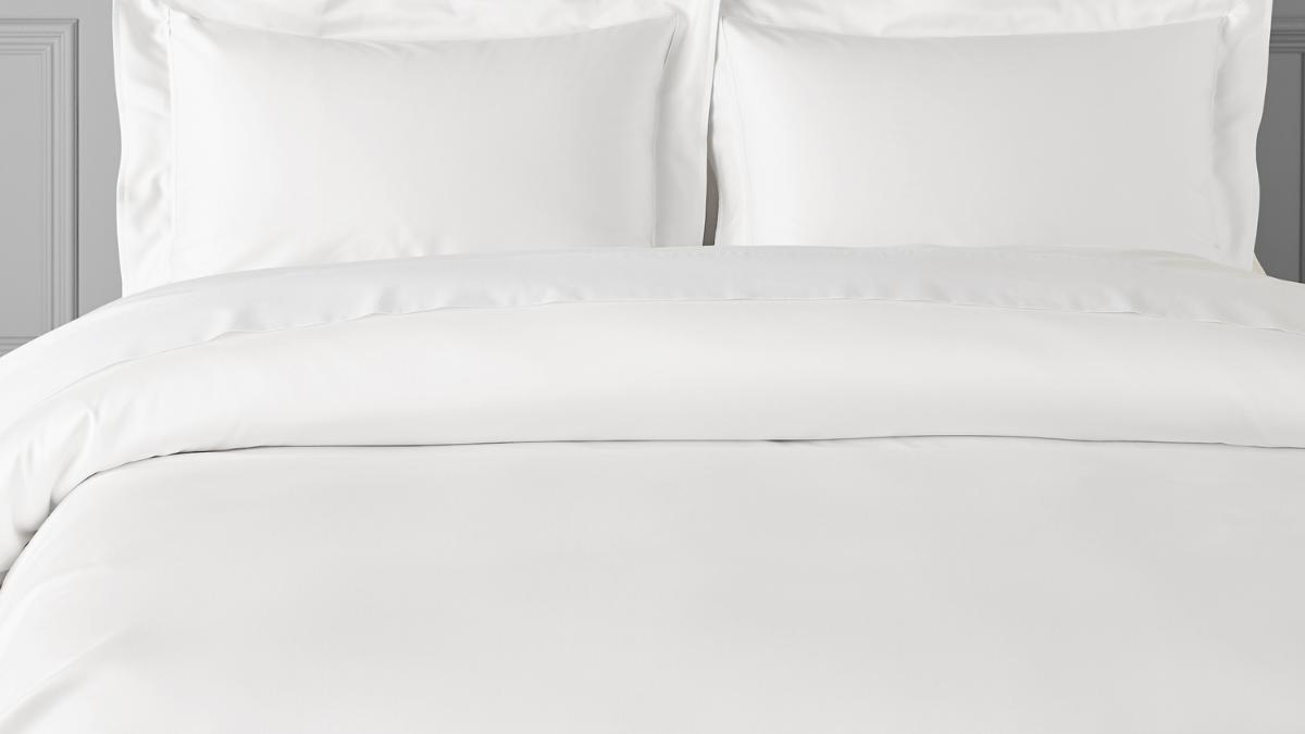 white bed sheet and pillows