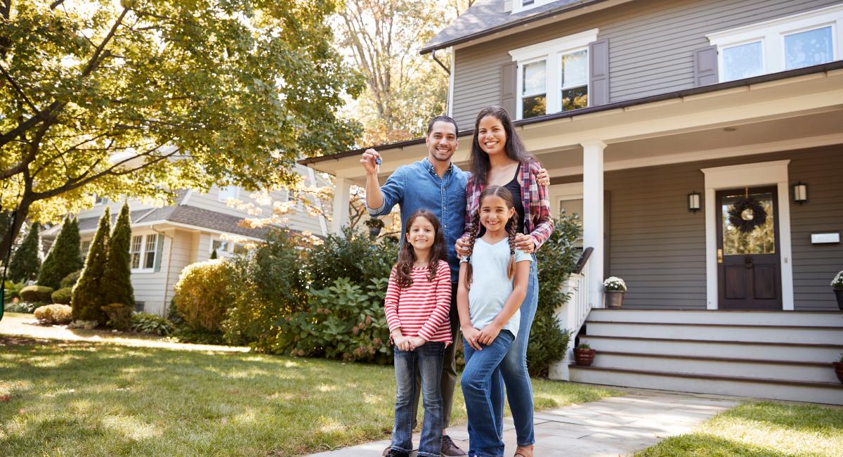 family taking a happy picture in the yard