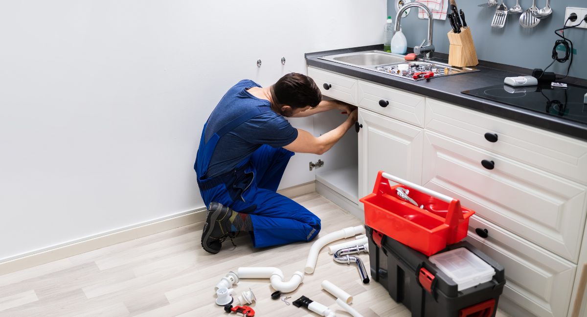 plumber fixing sink