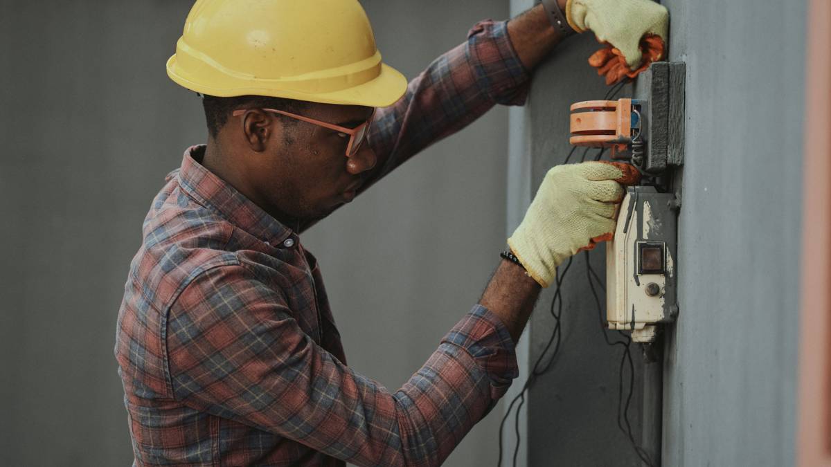 Electrician working in a circuit breaker