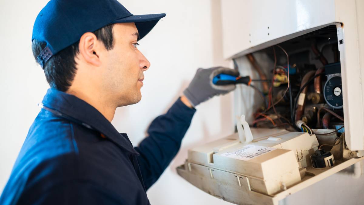 guy working on a electrical panel