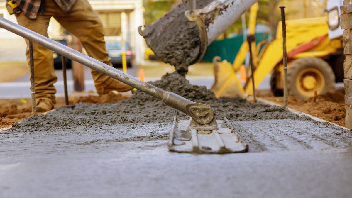 Workers pouring concrete