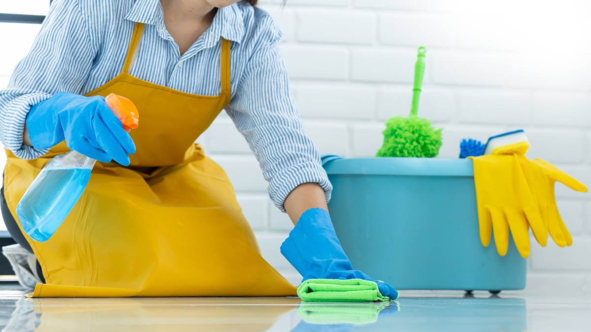 maid working the bathroom floor