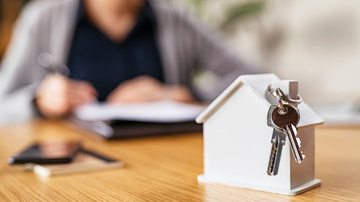 mini house replica with keys on it