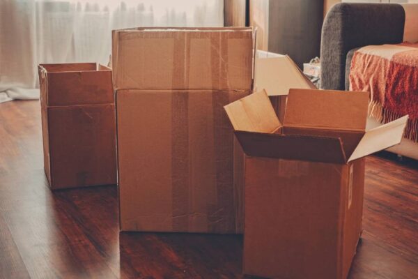 Empty boxes in the middle of living room