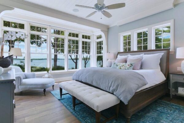 bright bedroom with ceiling fan