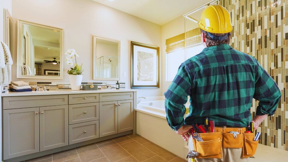 worker checking out bathroom