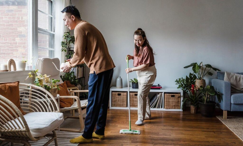 People happy in a clean and clutter-free living room after furniture rubbish removal.