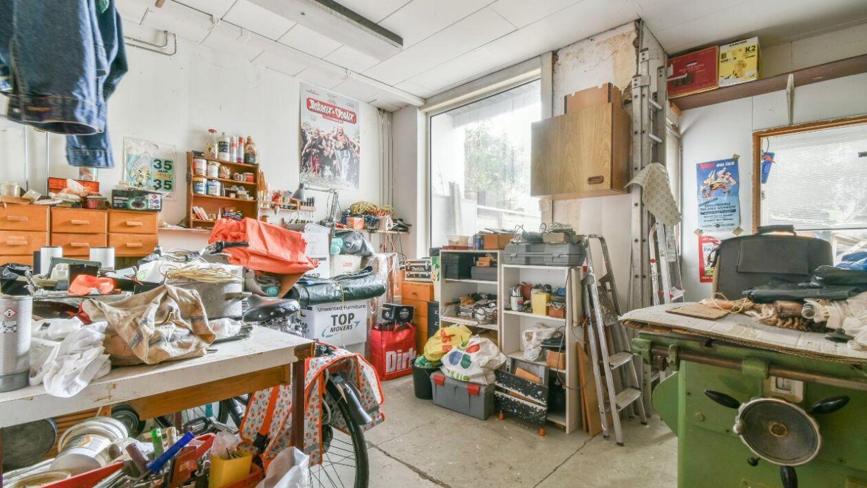 Cluttered room in need of old furniture removal in Sydney.