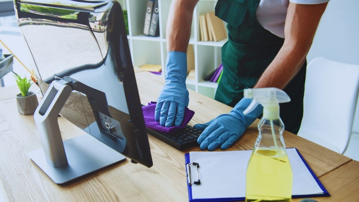 Worker, cleaning a desk