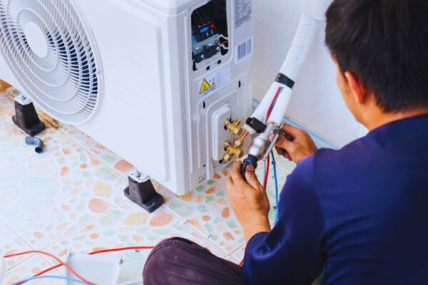 Worker installing AC