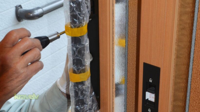 repairman doing a door replacement