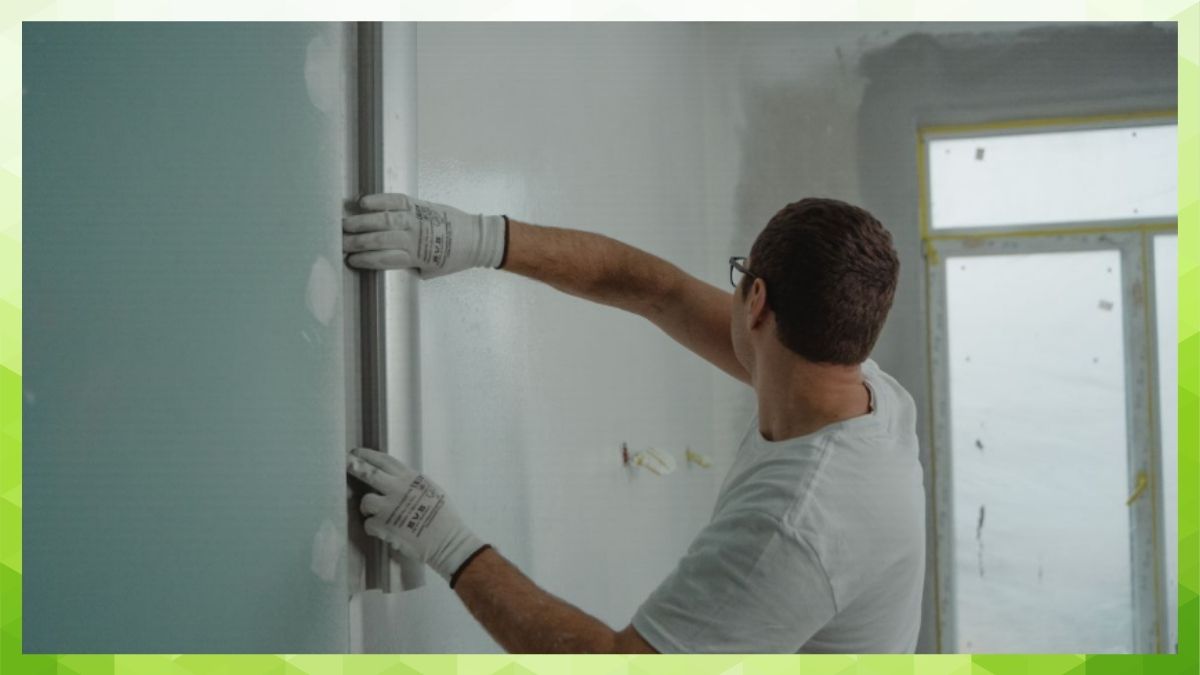 man working on a wall