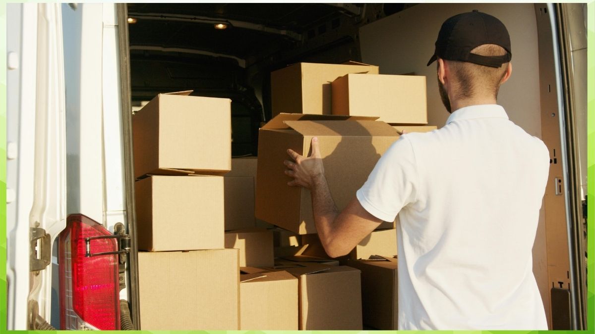 a person putting boxes in a vehicle